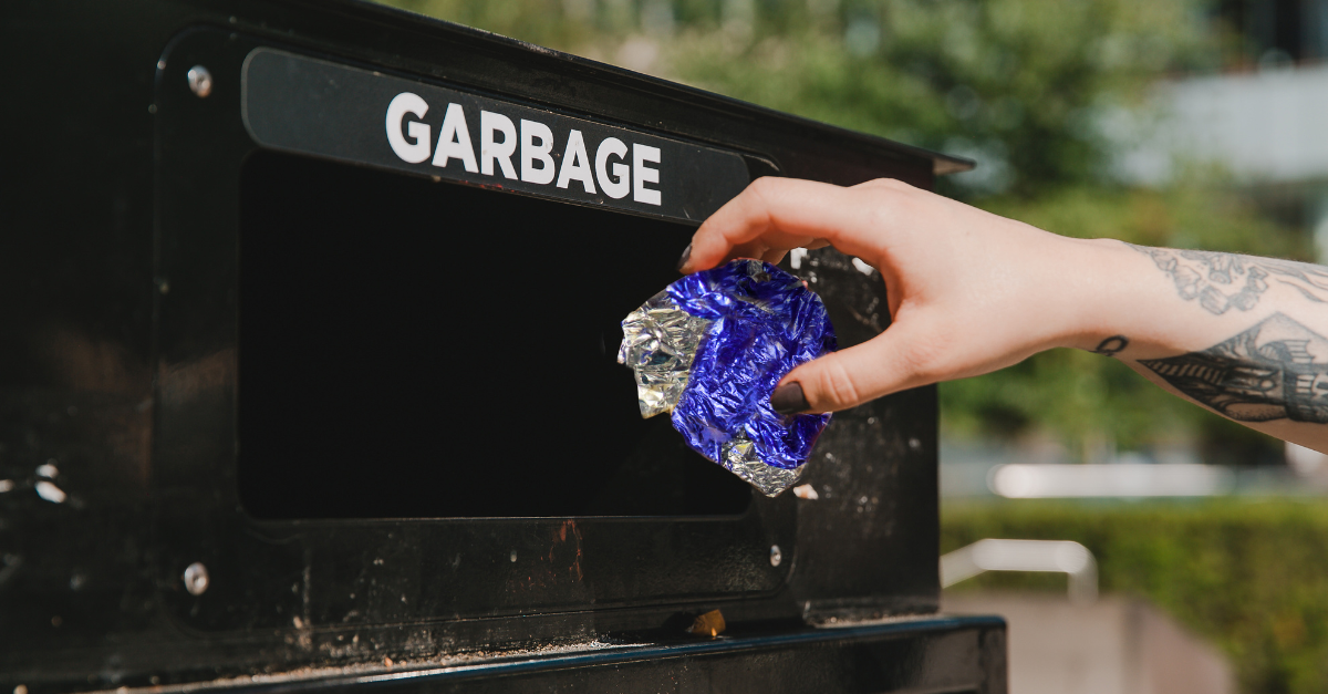 A Blue Trash Can With The Words Put Waste In It S Place And Recycling