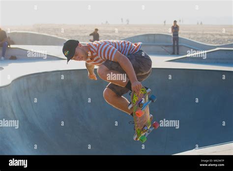 A Skateboarder Performing Tricks At Venice Beach Skatepark Santa