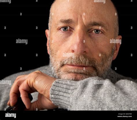 Confident And Positive 60 Years Old Man With A Beard A Headshot