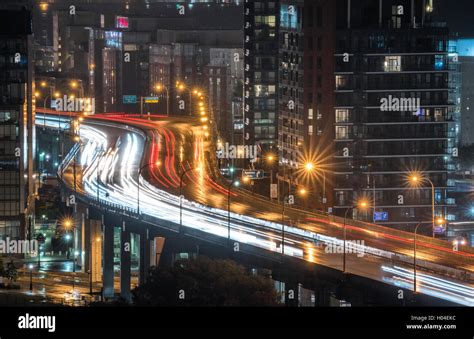 Glowing Light Streaks From A Wet Gardiner Expressway As Traffic Never