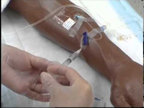 Intravenous Iv Therapy Administering Iv Medication Via A Saline Lock